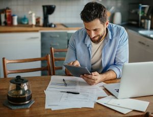 Photo of a man paying bills online